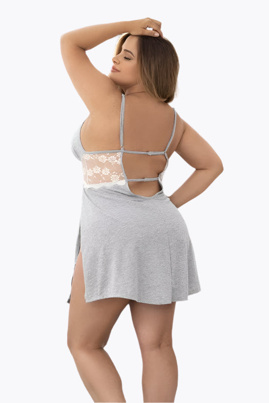 Woman wearing a gray nightgown with lace details in a bathroom setting