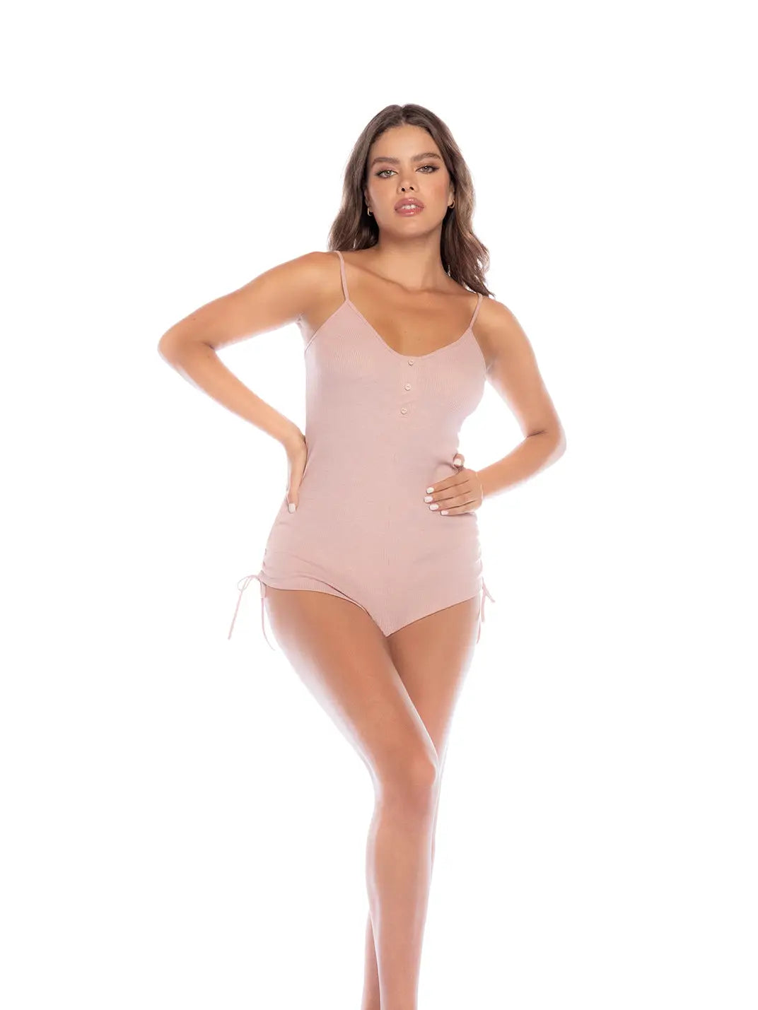 Woman wearing a light pink bodysuit on a white background