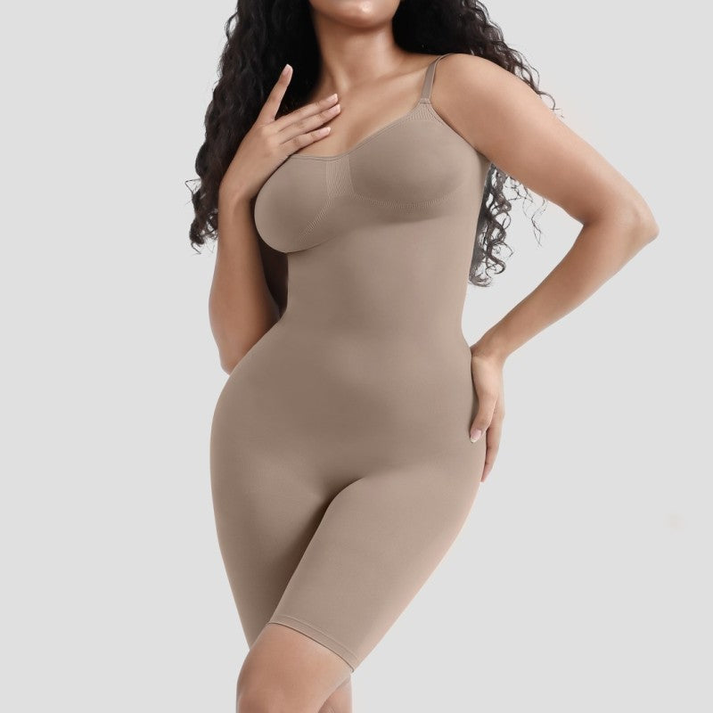 Woman wearing a beige shapewear bodysuit on a light gray background