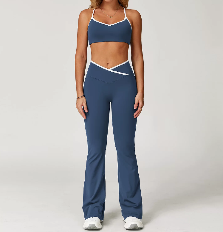 Person wearing a blue athletic outfit with white accents on a plain background